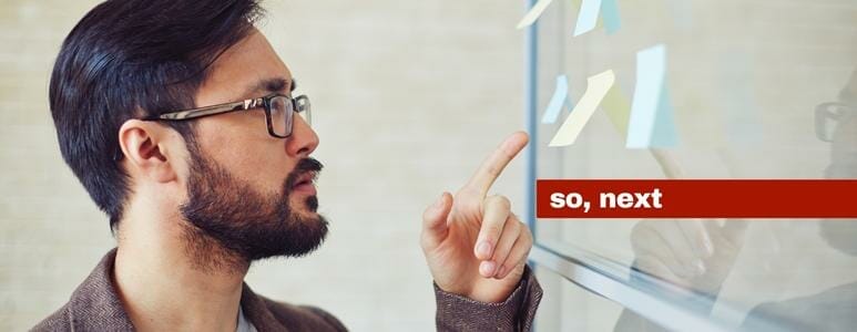 Man Pointing At Sticky Notes