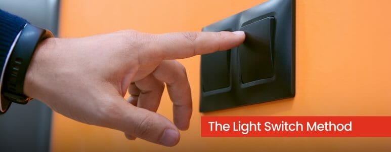 Man Pressing Light Switch