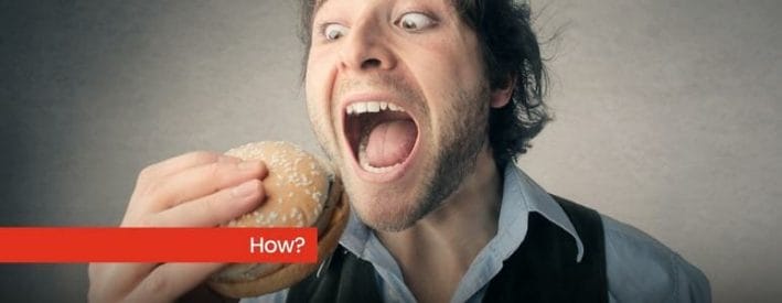 Man With Mouth Wide Open Looking At Burger