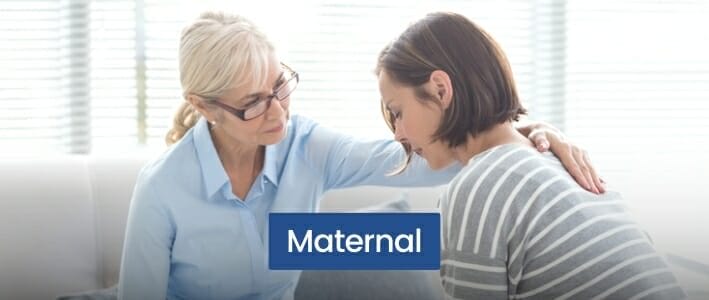 Blonde Woman With Glasses Comforting Black Haired Woman